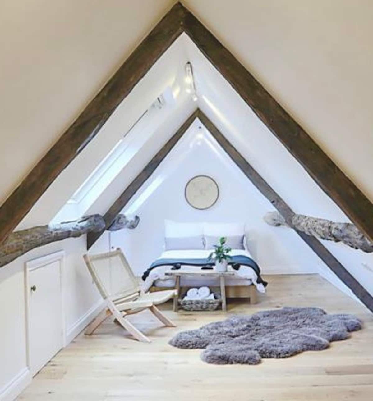 Top-floor room under the roof beams